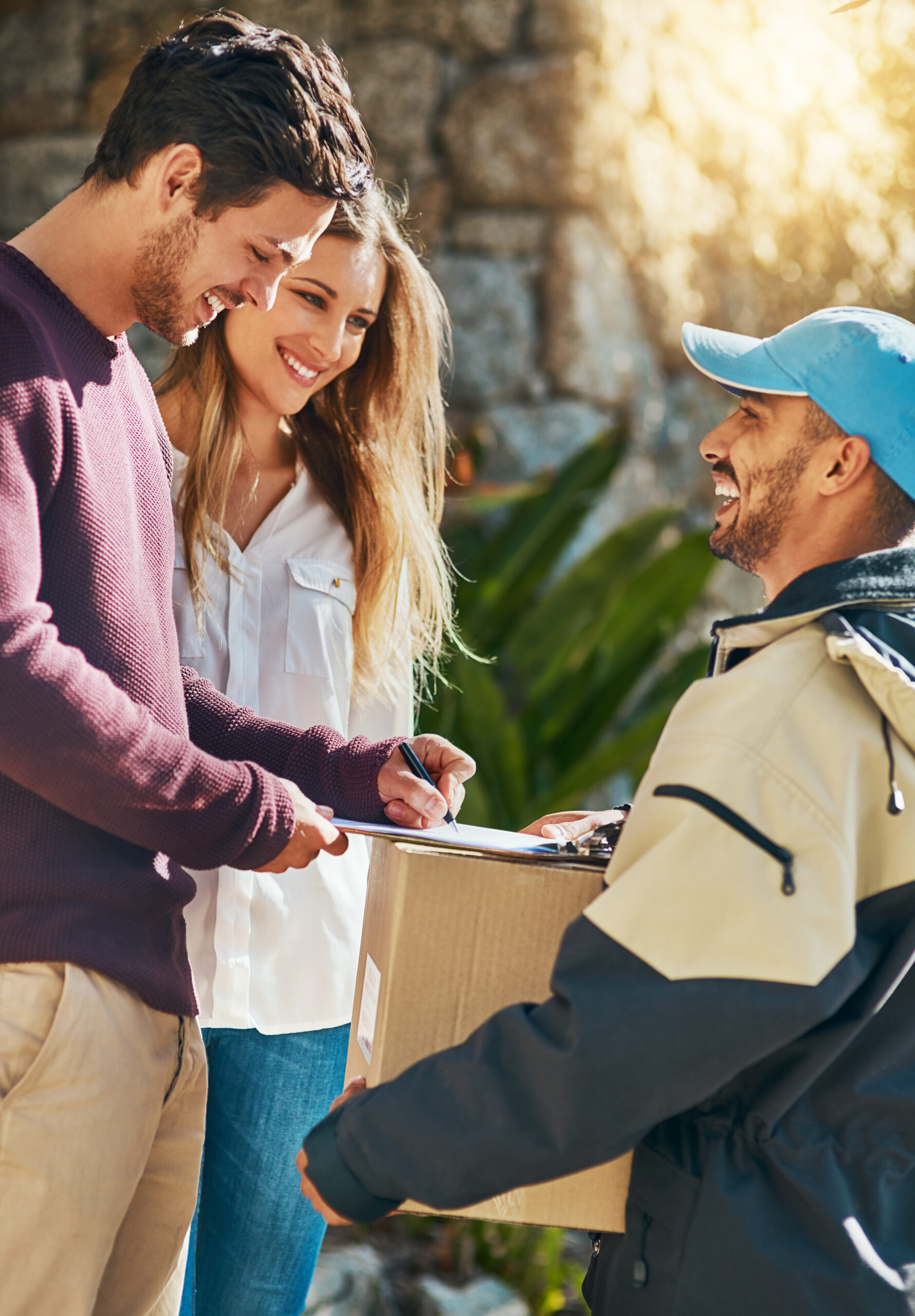 Family members receiving a package delivered fast by Ribrad.